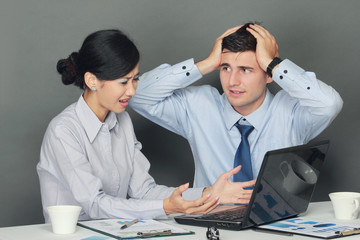 sad and depressed businessman and woman