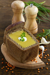Lentil soup in the bowl of bread.