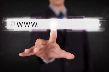 Young businessman touching web browser address bar with www sign