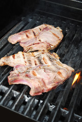 Two Pork Chops on a Flaming Grill