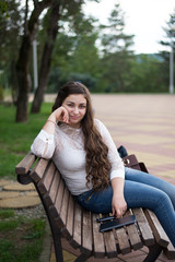 Young beautiful girl on a walk in the country