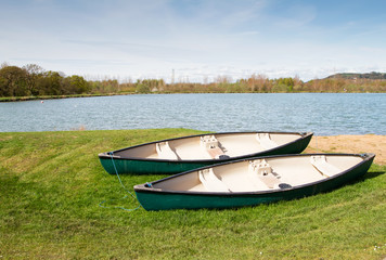 Two canoes near to a lake