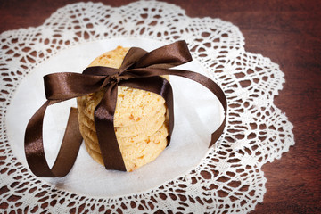 Stack of taped apple chip cookies on white table-napkin
