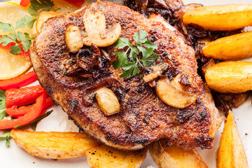 Fried pork chop with mushrooms and chips