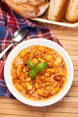 Beans with tomato sauce, bacon and sausage