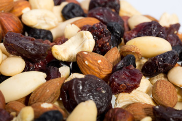 mixed nuts and dried fruits isolated on white background