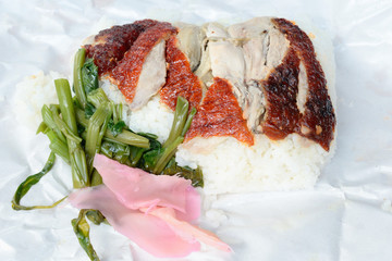 Roast duck over rice on Paper plate
