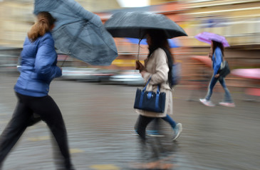 Group of people walking down the street