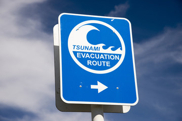 Tsunami flood evacuation route roadside sign