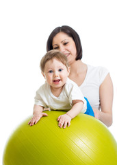 Fototapeta premium mother with baby having fun with gymnastic ball