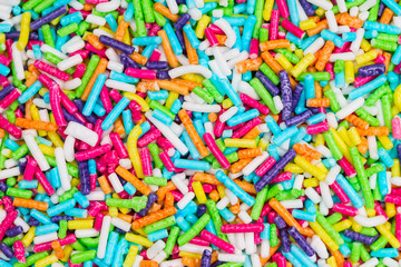 Fototapeta na wymiar Colorful sugar sticks sprinkles