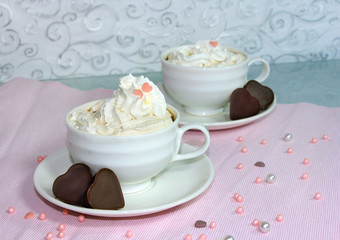 two cups of coffee with cream