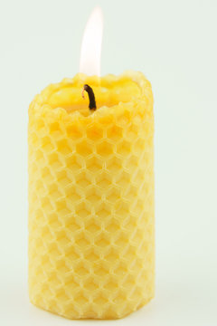 candle from honeycomb white background