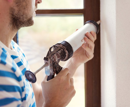 Man With Caulking Gun