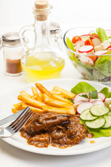 Pork chop with sauce, mushrooms and chips