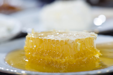 Honeycomb and butter at the background