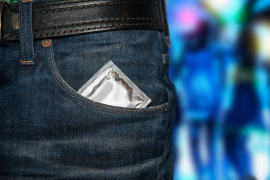 Concept photo of safety sex on date. Condom at the pocket.