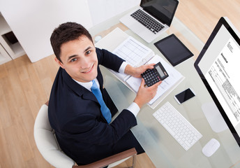 Businessman Calculating Tax