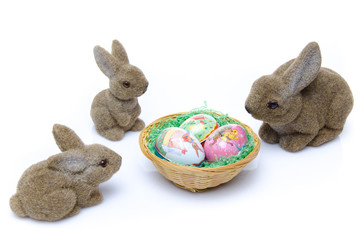Easter bunnies around a nest of eggs