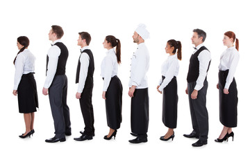 Fototapeta na wymiar Waiters and waitresses standing in queue