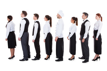 Obraz premium Waiters and waitresses standing in queue
