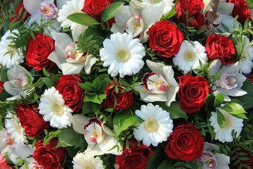 Cymbidium orchids, red roses and white gerberas