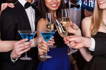 Friends Toasting Drinks At Nightclub