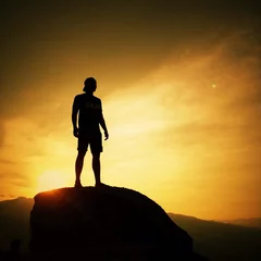Tuinposter silhouette of man on sunrise background © nasruleffendy