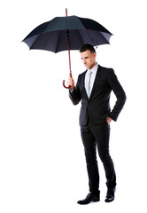 portrait of a businessman holding umbrella