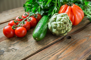Variety of ripe vegetable produce on wooden table