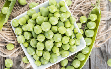 Fresh Peas on wooden background