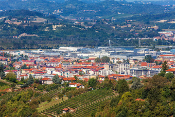 Fototapeta na wymiar Town of Alba among hills in Piedmont, Italy.