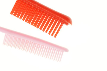 Pink and red comb different size isolated