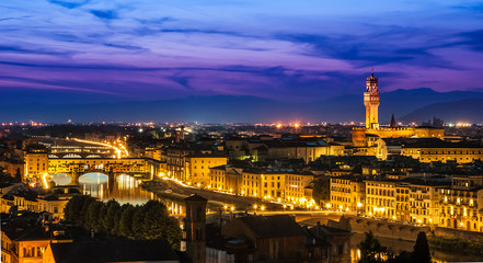 Fototapeta na wymiar Night view over Arno river in Florence, Italy