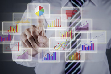 Obraz na płótnie Canvas Businessman choosing chart on business interface