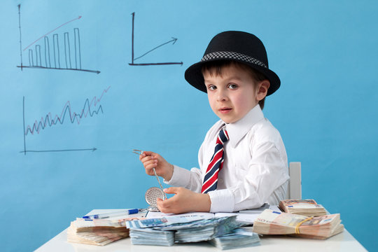 Young Boy, Counting Money And Taking Notes