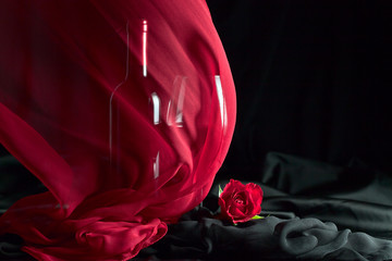 bottle and glass with red