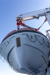 lifeboat hanging on the crane