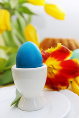 blue egg in a stand