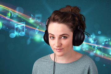 Young woman listening to music with headphones