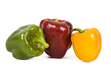 red green and yellow pepper isolated on white
