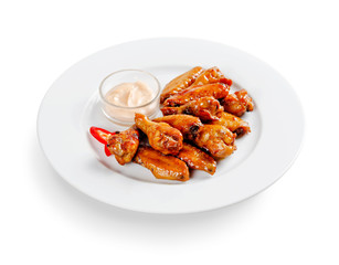 chicken baked in honey sauce. on a white background