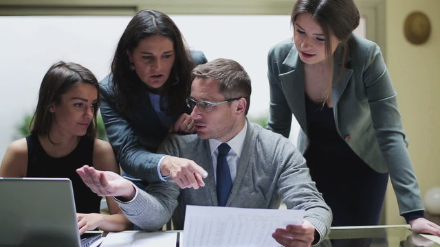 Businesspeople comparing results and arguing with each other