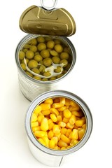 green peas and corn in a can on a white background