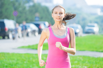Fototapeta premium Jogging woman running in city park