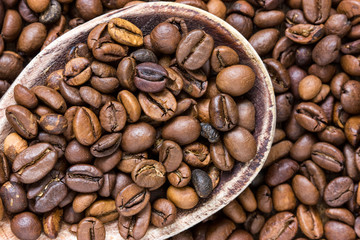 Coffee beans in wooden spoon