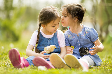 Two little girls with chickens