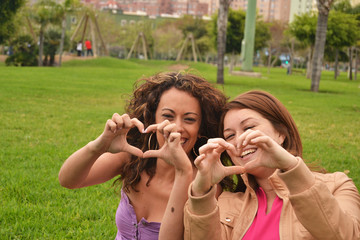Fototapeta premium Two young women fun in park