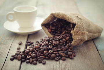 Sack of coffee beans with cup