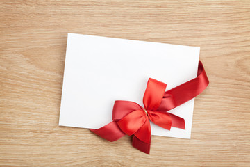 Blank valentines greeting card and red ribbon